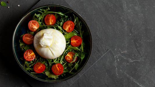 burrata is mozzarella stuffed with cream, and is a great salad addition
