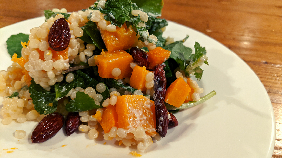 israeli couscous salad with butternut squash, roast almonds and kale